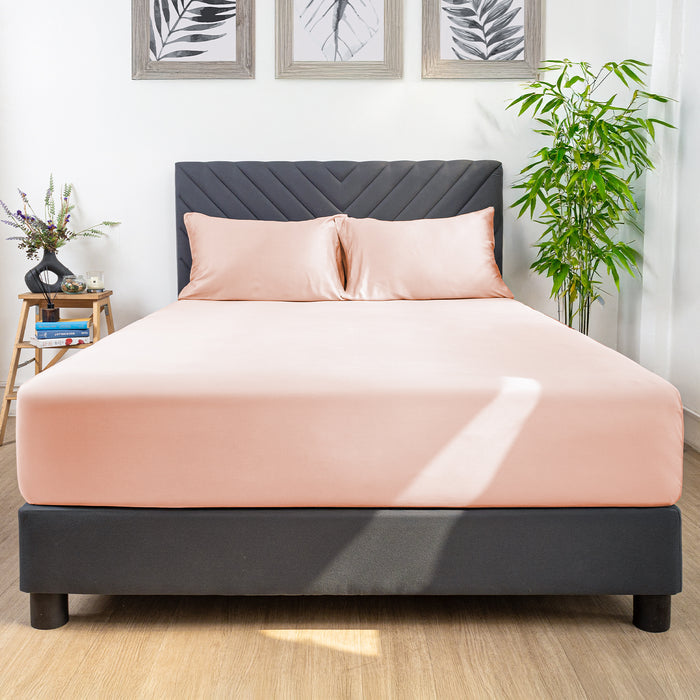 Eco Deluxe Bed Linens 3 Piece Fitted Sheet Set in peach and cream, shown in a room setting