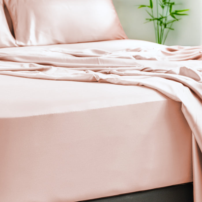 Eco Deluxe Bed Linens 4 Piece Flat Sheet Set in peach and cream, shown in a room setting