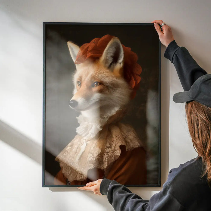 Fox Lady Animal Portrait Print being hung on a wall in a black frame