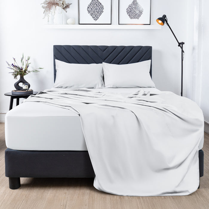 Premium Touch Bed Linens 4 Piece Flat Sheet Set in white, shown in a room setting