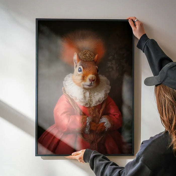Red Squirrel Lady Animal Portrait Print being hung on a wall in a black frame