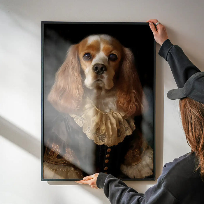 Tan & White Cocker Spaniel Dog Portrait Print being hung on a wall in a black frame
